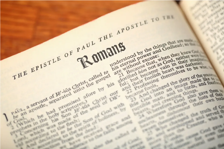 Open Bible showing the Epistle of Paul the Apostle to the Romans
